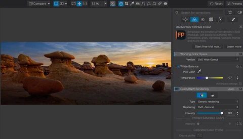 Screenshot of DxO photo editing software displaying a desert landscape at sunset