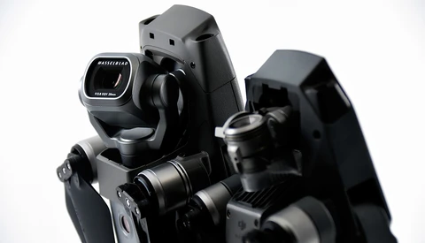 Professional camera rig with dual cinema lenses and integrated viewfinder mounted on rails