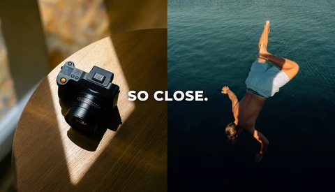 Split-screen comparison with compact camera on wooden surface and person diving into turquoise water with text overlay 'SO CLOSE'