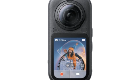 Compact handheld action camera with flip-out LCD touchscreen displaying video interface