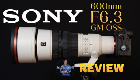 Sony 600mm F6.3 GM OSS telephoto lens positioned horizontally with camera body attached on right side