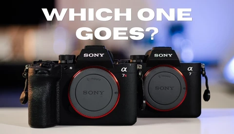 Two Sony Alpha mirrorless cameras side by side with red accent rings around their lens mounts