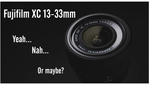 Graphic illustration of Fujifilm XC 13-33mm lens with indecisive text overlay
