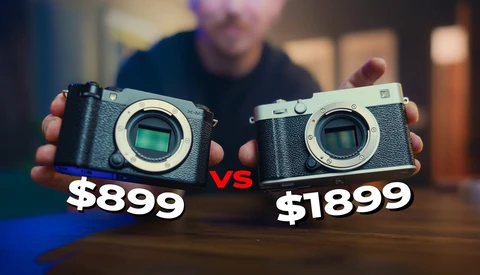 Two mirrorless cameras held side by side, priced at $899 and $1899