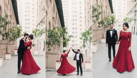 Couple in formal attire dancing and posing in urban courtyard with modern buildings