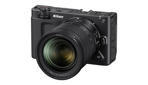 Nikon Z mirrorless camera with attached zoom lens on white background