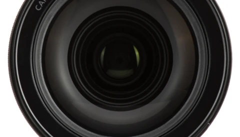 Front view of a camera lens with multiple glass elements visible through the barrel