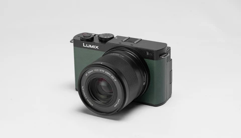 Panasonic Lumix compact camera with sage green body and black lens