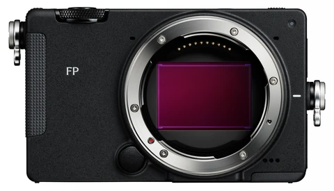 Black mirrorless camera body without a lens, showing the exposed sensor inside a silver bayonet lens mount, with "FP" printed on the front.