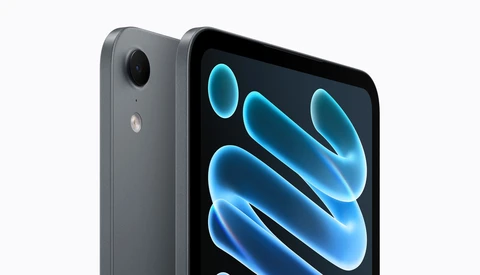 Dark gray tablet angled to show its rear camera and screen with glowing blue abstract wave graphics.