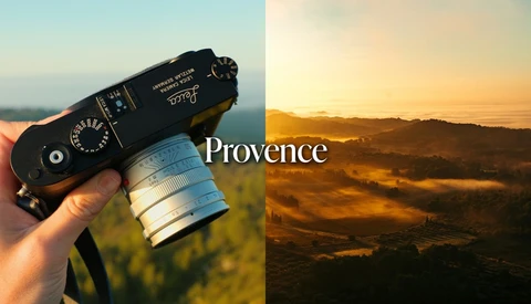 Hand holding a black Leica rangefinder camera with silver lens, beside a misty golden-hour valley labeled Provence.