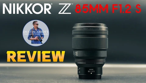 Video review thumbnail showing the Nikon Z 85mm f/1.2 S lens standing upright on a dark surface with bold 'REVIEW' text.