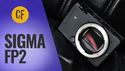 Video thumbnail for the Sigma FP2 camera, showing the black compact body with its exposed sensor on black leather, beside bold white text.