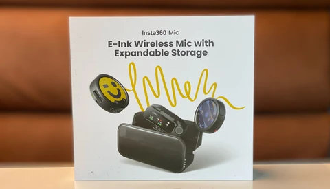 Insta360 Mic product box showing two wireless mic clips and a charging case with an E-Ink display, with a yellow squiggle graphic.