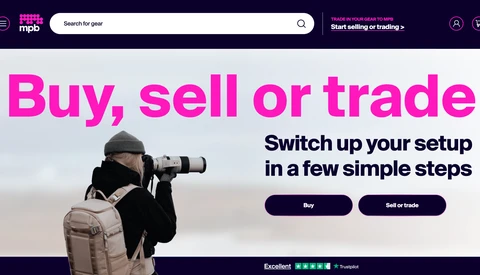 Screenshot of the MPB website homepage with the headline 'Buy, sell or trade' and a photographer using a white telephoto lens.