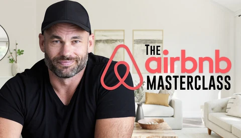 Man in black cap and shirt smiling at camera in bright, minimalist interior space with Airbnb Masterclass logo overlay.