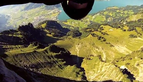 Wing-Suit Base Jumper Skims Feet Above The Ground