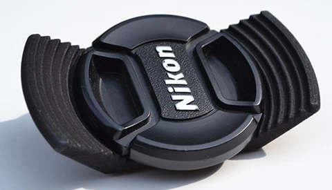 The Stow-Away Lens Cap Holder