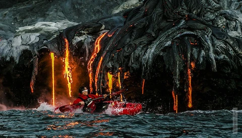 Thrill Seeking Kayakers & A Photographer Chase Hot Lava
