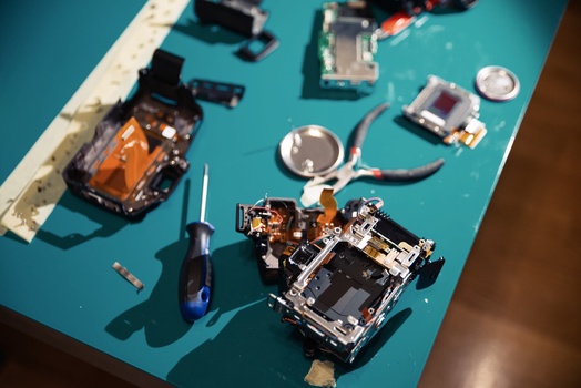 camera disassembled with tools