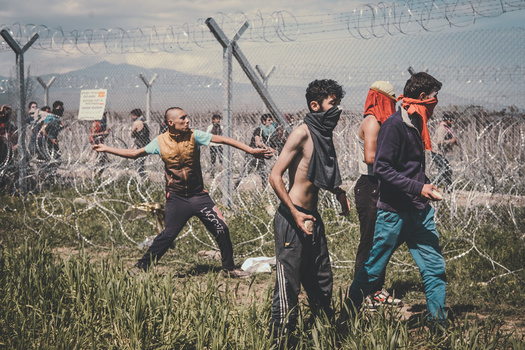 young men barbed wires