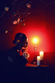 woman light candles
