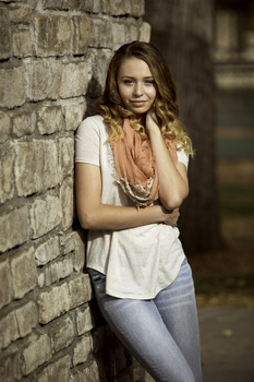 Portrait of a teenaged girl in hard sunlight at the park