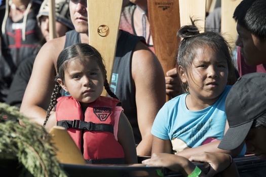 Two young native girls sitting patiently in the canoe. Photo by Gabrielle Colton Two young native girls sitting patiently in the canoe. Photo by Gabrielle Colton
