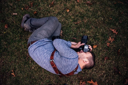 Writer Jason Vinson in the fetal position to get the perfect shot Writer Jason Vinson in the fetal position to get the perfect shot