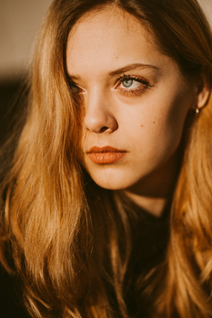 Build good relationship with your photography clients. Close-up of a young blond woman.