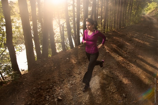 Girl running by the lake Girl running by the lake