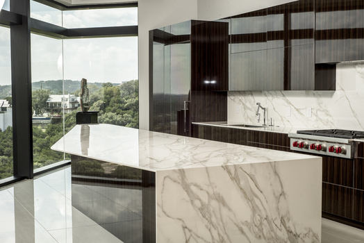 an interior behind-the-scenes photo showing the flash frame of a kitchen with glare on the countertop surface