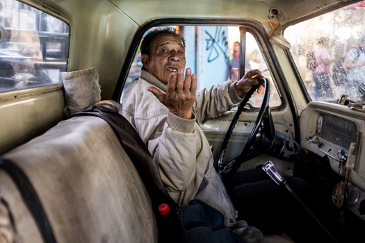 Shooting street photography in Mexico An older man in a vintage car