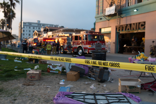 a photo of a hit-and-run scene in California with police tape cutting through the image