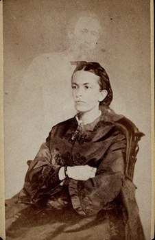 A William Mumler portrait with a ghostly man standing behind the female subject.