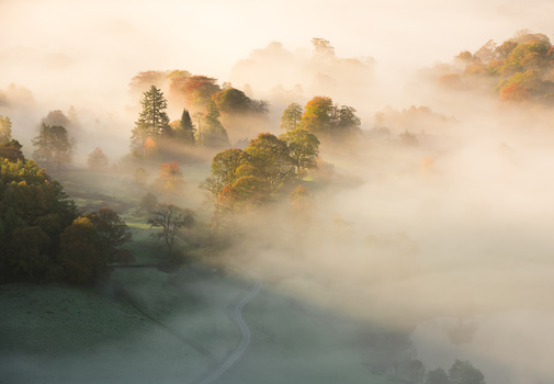 By using a zoom lens you can pick out many different compositions Morning mist in the lake district