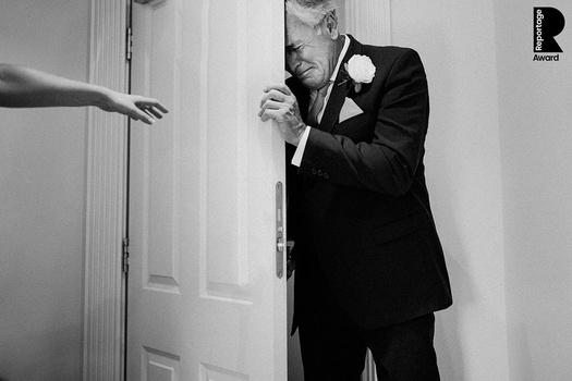 Photographing documentary style weddings. A father of the bride crying.
