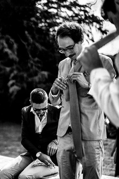 Working with your partner in your photography business Groomsmen getting ready before a wedding