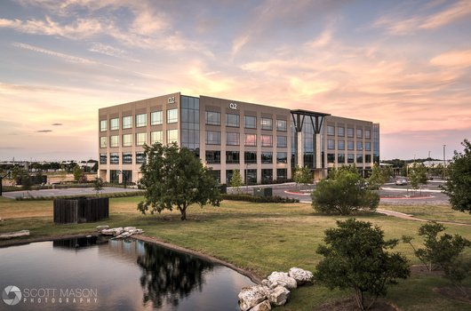 an HDR photo of an office building at sunsrt