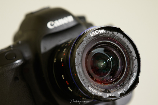 It is possible to add water-resistant coatings on front lens elements, like this Laowa 12mm zero-D lens. Water does not stick onto the lens and if it does, you can blow it of without leaving a trace. It is really amazing.