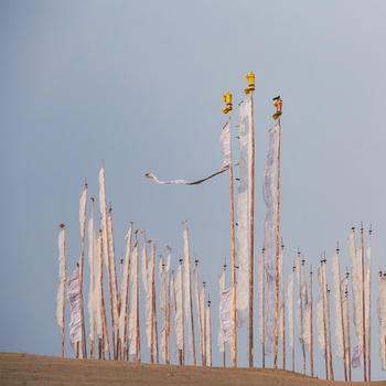 Prayer flags and an incoming storm Prayer flags along a ridge