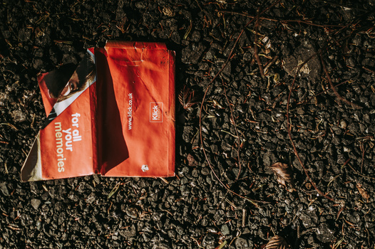 simple street photography projects for beginners A red package discarded on the street