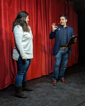 A photo of a magician performing A photo of a magician performing