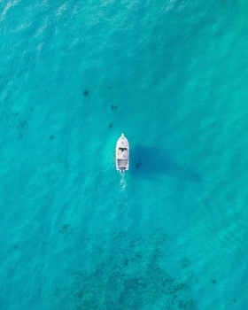 Boat in Blue Water Boat in Blue Water