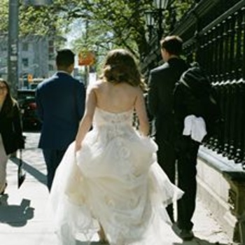 bride and groom walking down the street after wedding