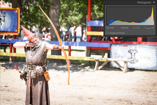 an overexposed image of an archer with a histogram