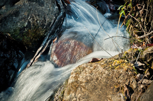 a close-up photo of a miniature waterfall