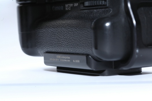 The L-bracket is designed for a specific camera model, like this Kirk Enterprises L-bracket for the Canon EOS 20D. There is no risk this plate will rotate when connected to the tripod.