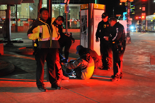 Photographer Avi Adelman arrested for taking photographs in public. Paramedics attending a scene of an injured person.