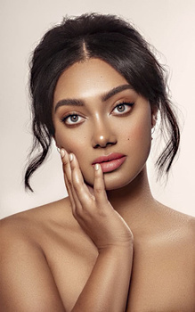 glamour portrait of a woman with her hand on face
